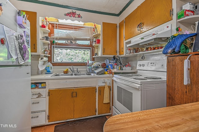 kitchen with sink, a textured ceiling, electric range, stainless steel fridge, and exhaust hood