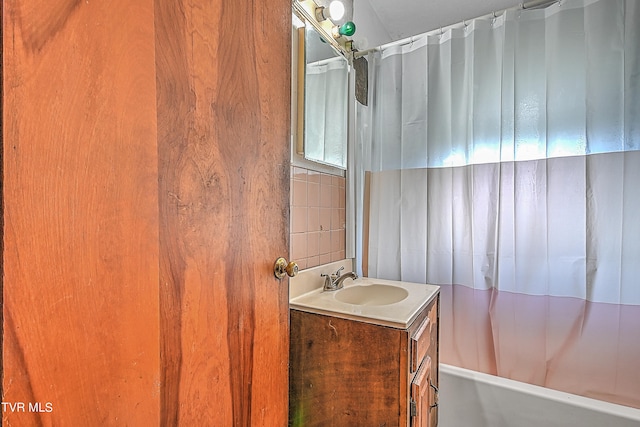 bathroom with vanity and shower / bathtub combination with curtain