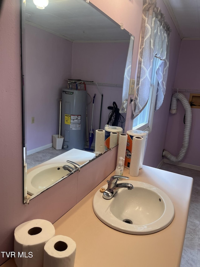 bathroom featuring a sink, water heater, and crown molding