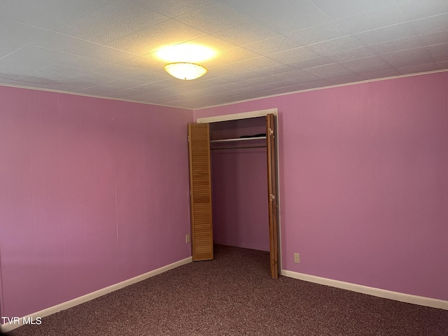 unfurnished bedroom with carpet floors and a closet