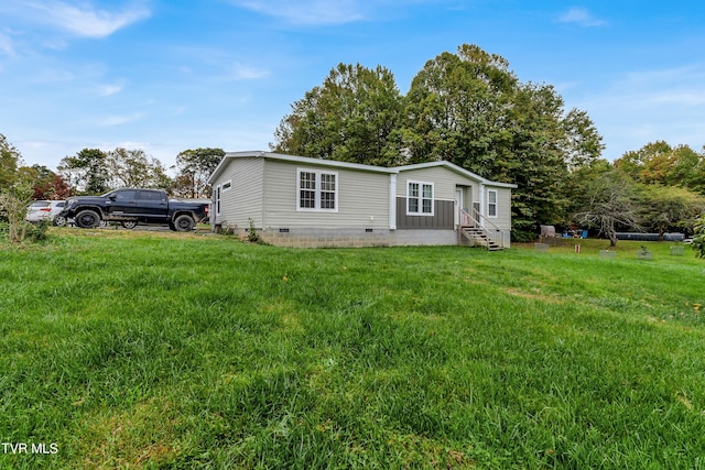 rear view of house with a lawn