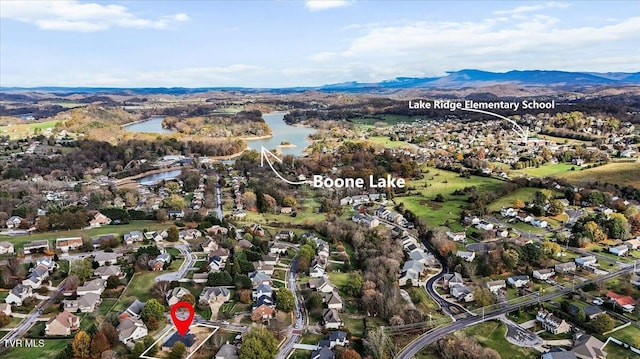 birds eye view of property featuring a residential view and a water and mountain view