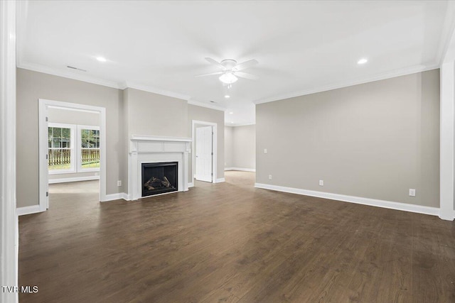 unfurnished living room featuring baseboards, a ceiling fan, ornamental molding, dark wood-type flooring, and a fireplace