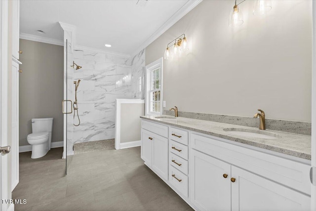 full bath with crown molding, a sink, toilet, and double vanity