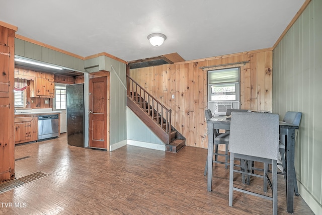 kitchen with dishwasher, cooling unit, dark hardwood / wood-style flooring, wooden walls, and crown molding