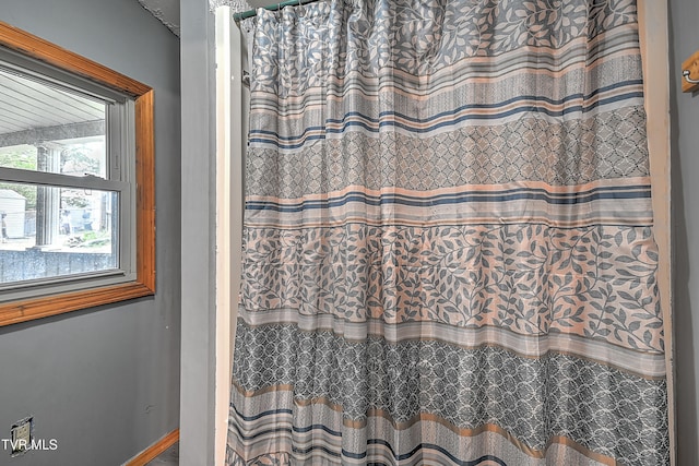 bathroom featuring walk in shower