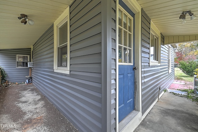 view of exterior entry with a porch