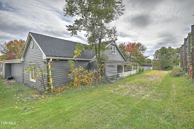 view of home's exterior featuring a lawn