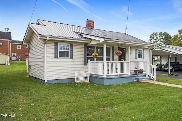 1312 Happy Valley St, Elizabethton, TN 37643 - bungalow-style home featuring a front yard, a chimney, metal roof, a porch, and a carport