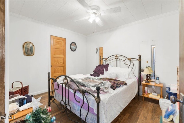 bedroom with ceiling fan, ornamental molding, and dark hardwood / wood-style floors