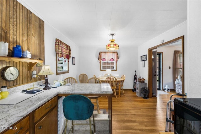 1312 Happy Valley St, Elizabethton, TN 37643 - dining area featuring light wood-type flooring and crown molding