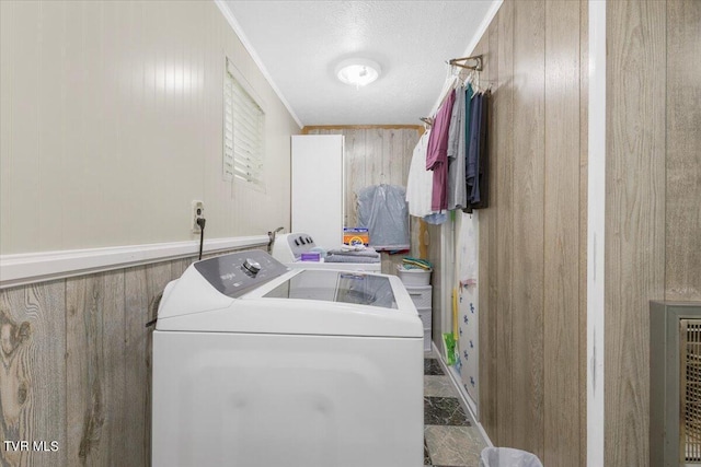1312 Happy Valley St, Elizabethton, TN 37643 - washroom featuring laundry area, wood walls, and washing machine and clothes dryer