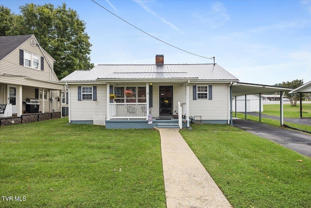 1312 Happy Valley St, Elizabethton, TN 37643 - bungalow-style home with covered porch, driveway, a chimney, and a front yard
