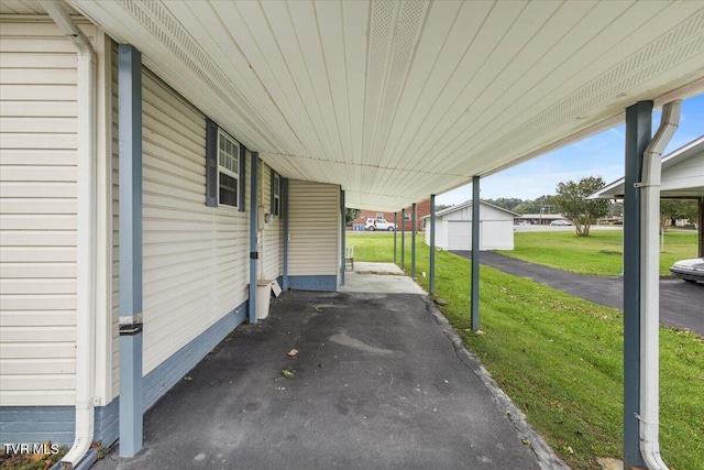 view of patio with an outdoor structure and a garage