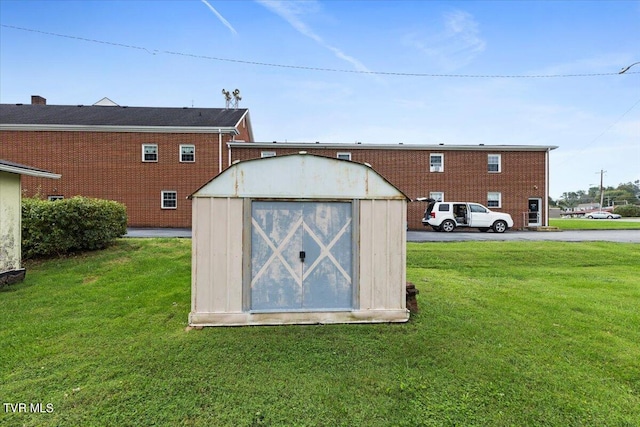 view of outbuilding featuring a yard