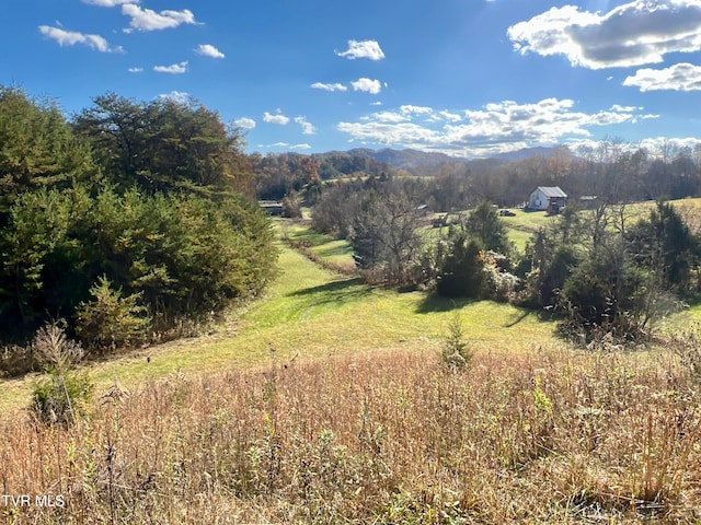 property view of mountains featuring a rural view