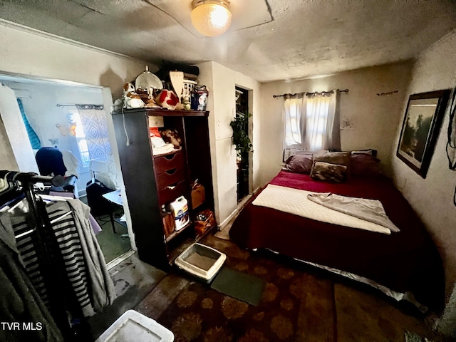 bedroom featuring dark colored carpet