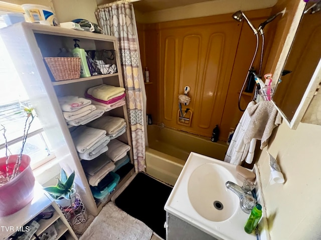 bathroom featuring sink and shower / tub combo with curtain