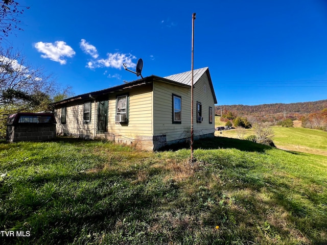 view of property exterior with a lawn