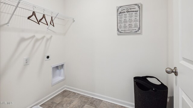 washroom with laundry area, electric dryer hookup, and baseboards