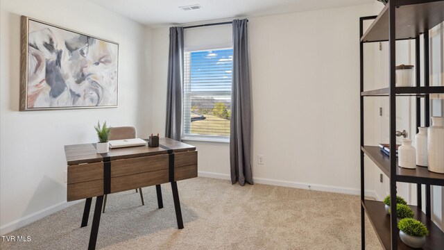 carpeted home office with visible vents and baseboards