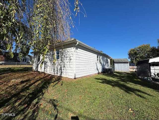 view of side of property with a yard