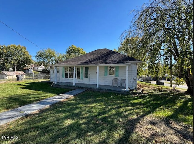 bungalow-style home featuring a front lawn