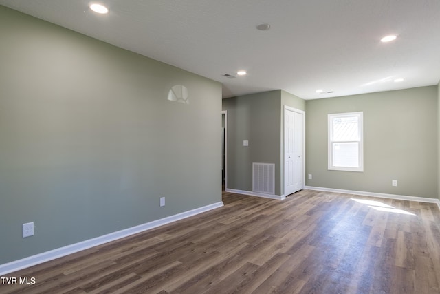 1608 E Fairview Ave, Johnson City, TN 37601 - empty room featuring baseboards, visible vents, recessed lighting, and dark wood-style flooring