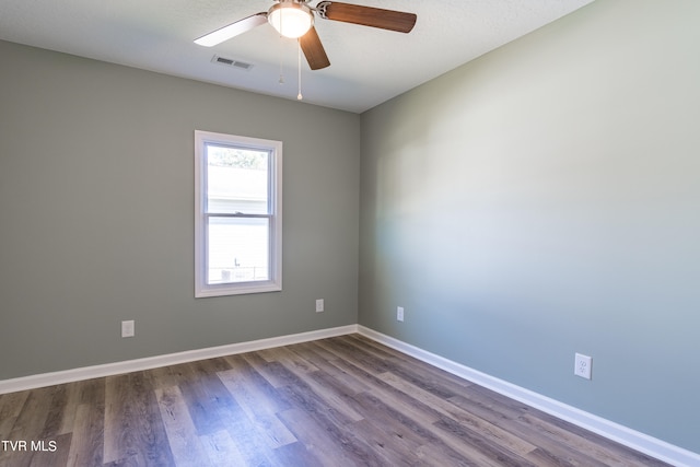 unfurnished room with hardwood / wood-style floors and ceiling fan