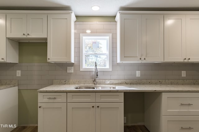 1608 E Fairview Ave, Johnson City, TN 37601 - kitchen featuring white cabinetry, tasteful backsplash, and a sink
