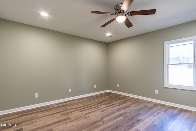 unfurnished room featuring ceiling fan and light wood-type flooring