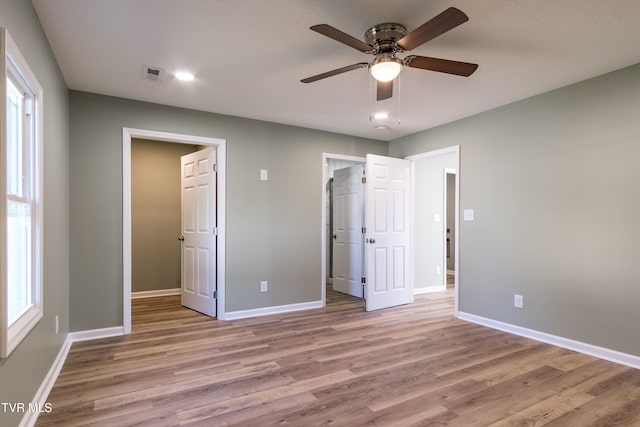 unfurnished bedroom with light hardwood / wood-style floors and ceiling fan