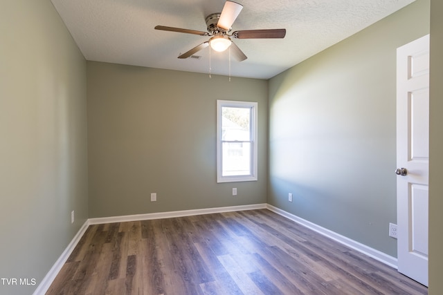 unfurnished room featuring a textured ceiling, dark hardwood / wood-style floors, and ceiling fan