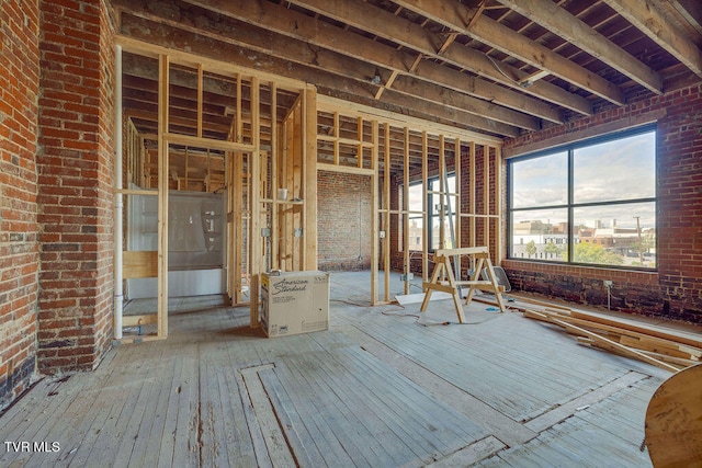 miscellaneous room featuring brick wall