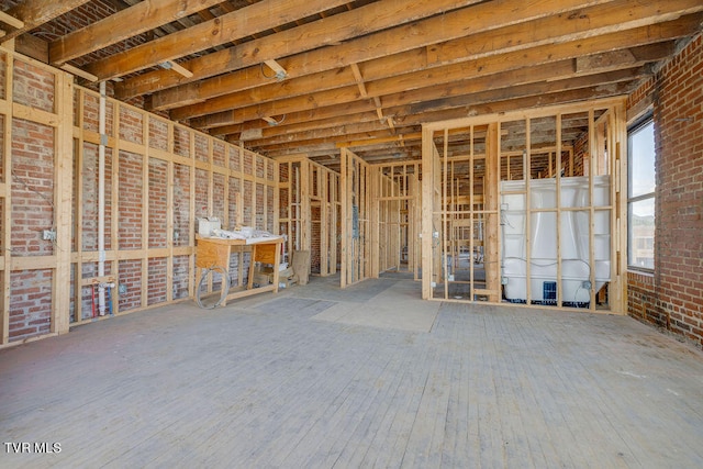 miscellaneous room with brick wall