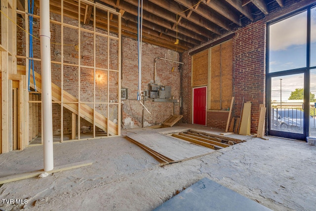 miscellaneous room featuring brick wall