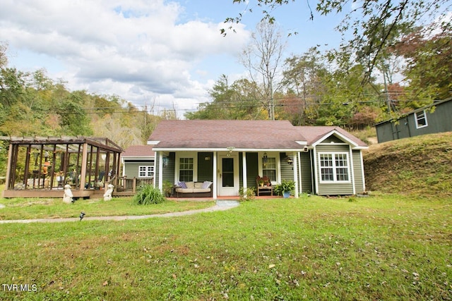 view of front of house featuring a front yard and a deck