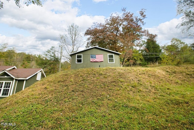 view of property exterior featuring a yard