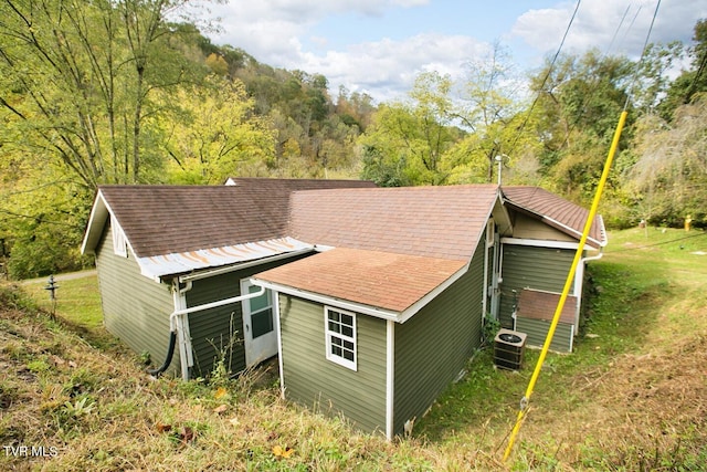 view of outbuilding featuring central AC