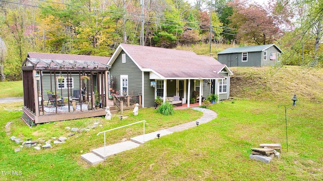 rear view of property with a wooden deck and a yard