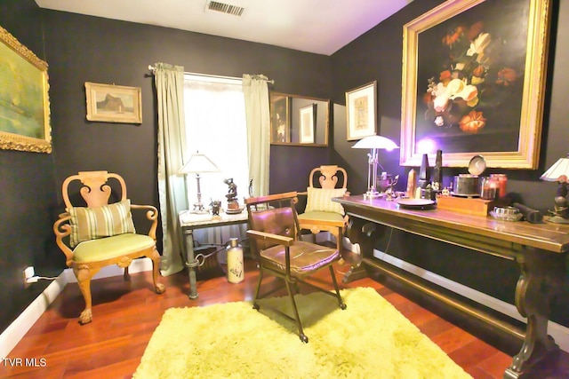 sitting room with dark hardwood / wood-style floors