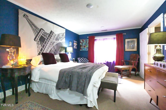 bedroom with light colored carpet