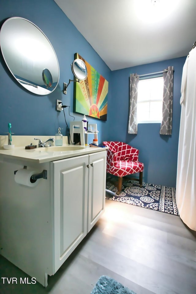 bathroom featuring vanity and wood-type flooring