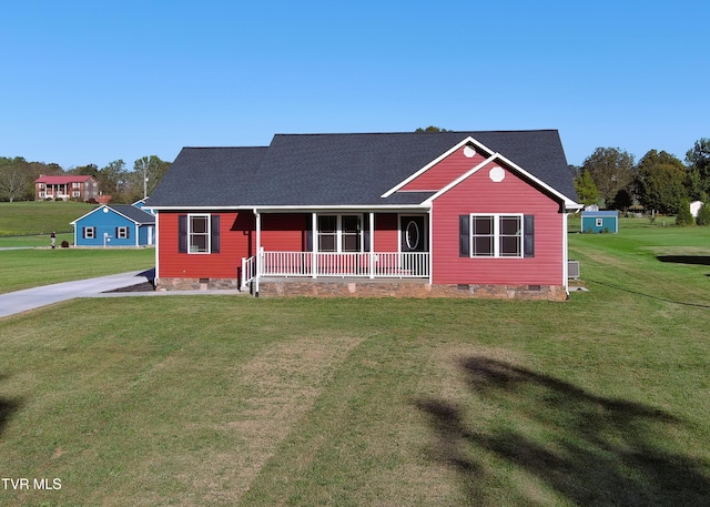 view of front of home with covered porch and a front lawn