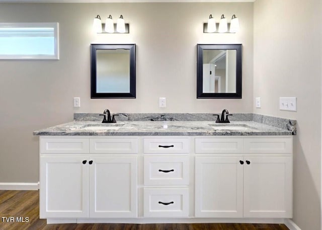 bathroom featuring vanity and hardwood / wood-style flooring