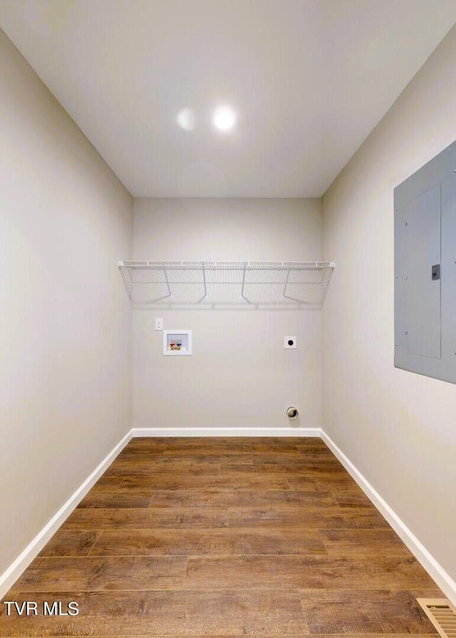 clothes washing area featuring hookup for an electric dryer, washer hookup, electric panel, and dark hardwood / wood-style floors