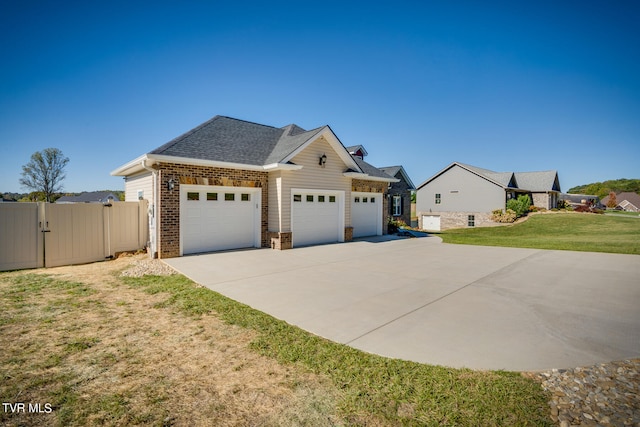 view of front facade featuring a front lawn and a garage