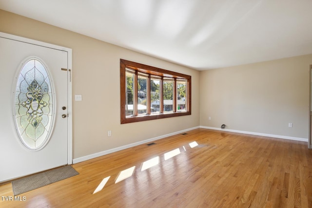 foyer with plenty of natural light and light wood-type flooring