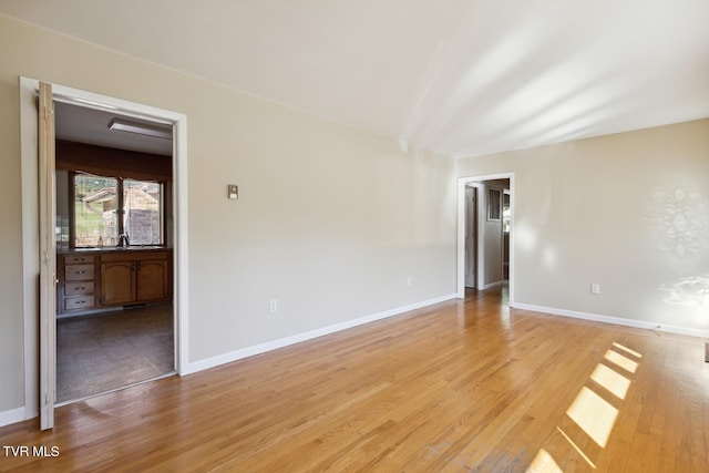 spare room with light hardwood / wood-style flooring