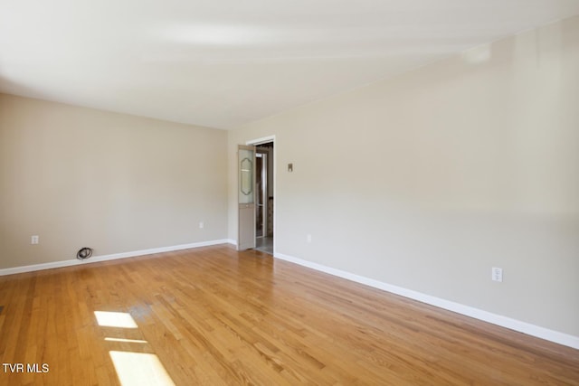 unfurnished room with light hardwood / wood-style floors